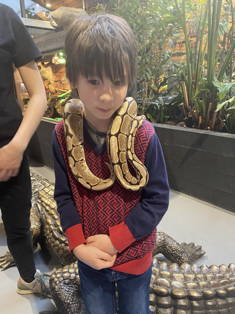 Max with a Ball Python at the lower floor of the Reptielenhuis De Aarde zoo