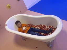 Max in a bathtub at the SuperNova Experience museum
