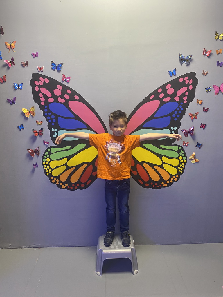 Max with a butterfly at the SuperNova Experience museum