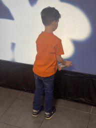 Max making graffiti at the graffiti room at the SuperNova Experience museum