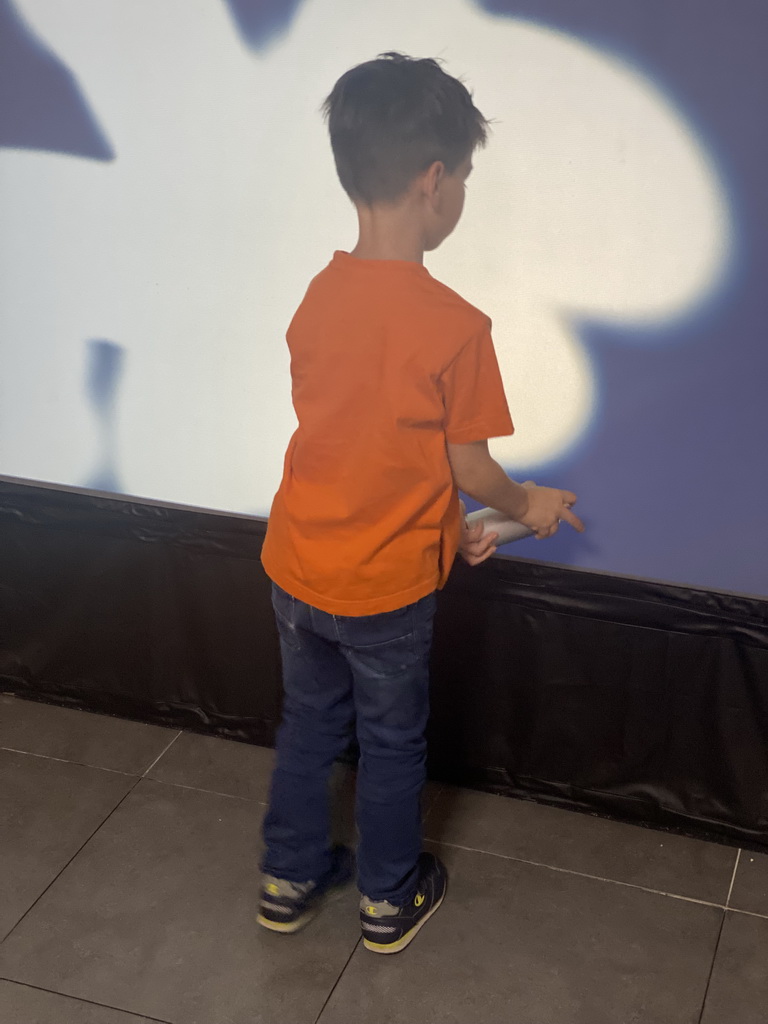 Max making graffiti at the graffiti room at the SuperNova Experience museum