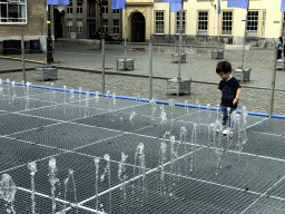 Max at the Peace Fountain at the Kasteelplein square