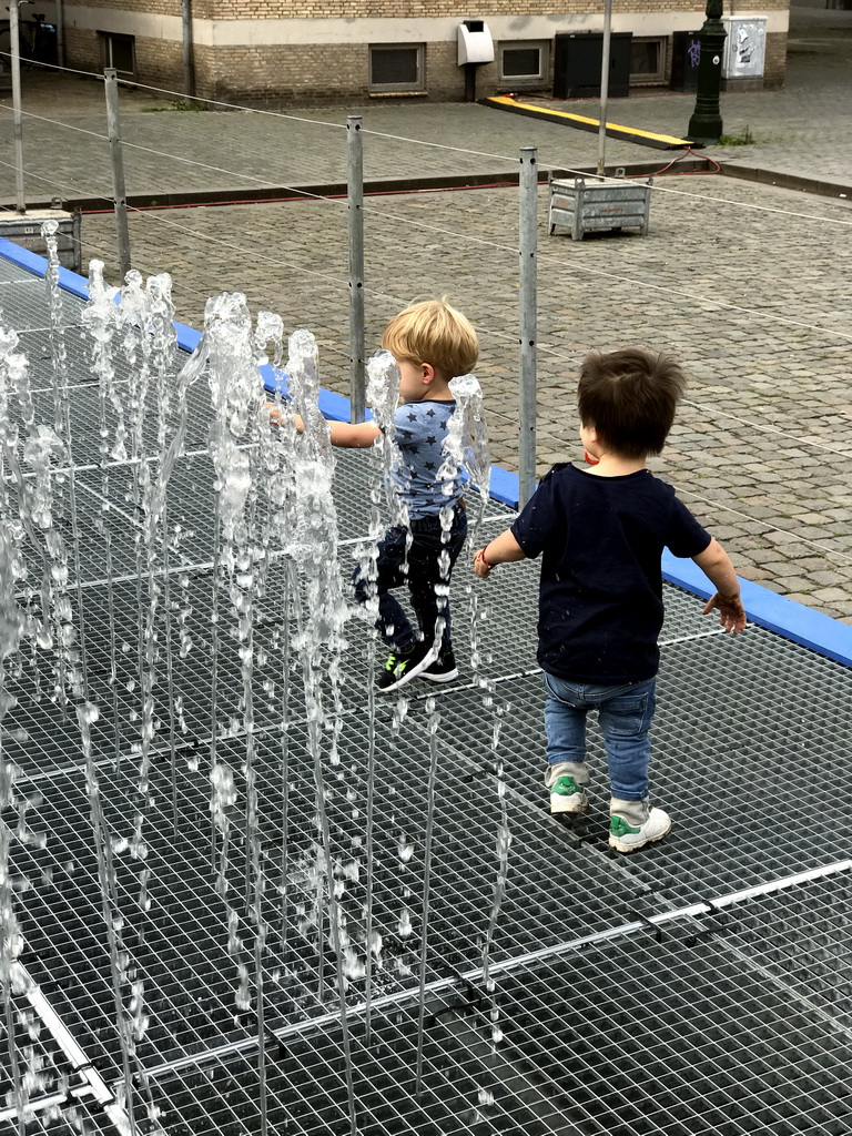 Max and another child at the Peace Fountain at the Kasteelplein square