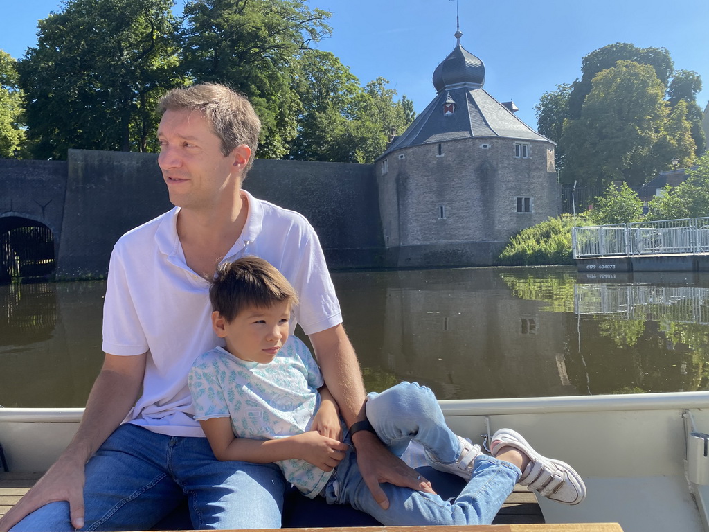 Tim and Max on our tour boat at the Nieuwe Mark river, with a view on the Spanjaardsgat gate