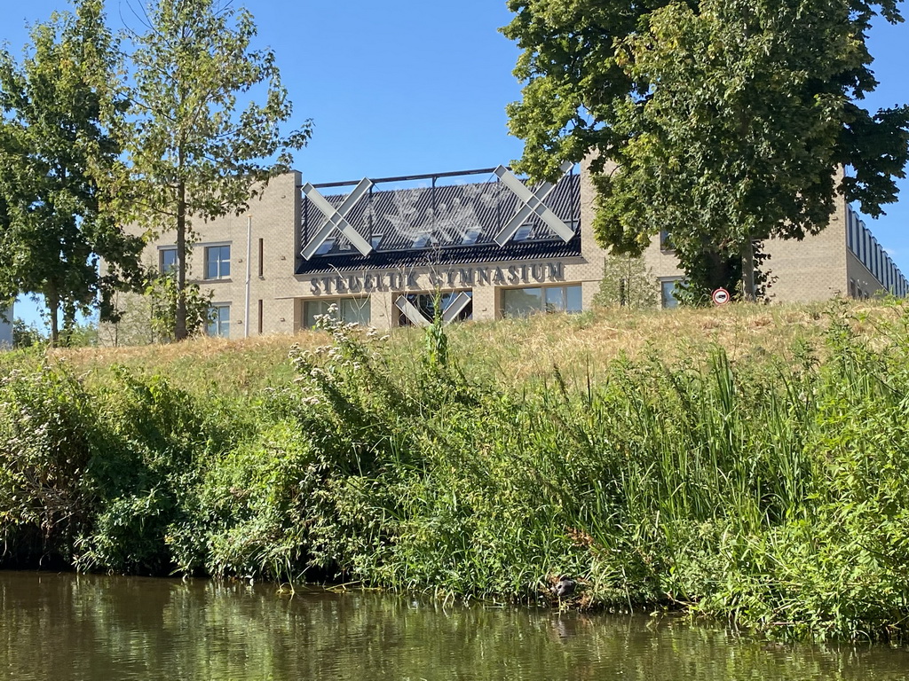 The Mark river and the front of the Stedelijk Gymnasium Breda highschool at the Nassausingel street, viewed from our tour boat