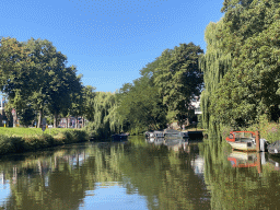 Boats on the Mark river and trees at the Generaal van der Plaatstraat street, viewed from our tour boat