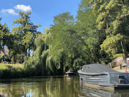 Boats on the Aa of Weerijs river and trees at the Marksingel, viewed from our tour boat