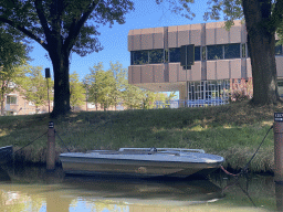 Boat on the Aa of Weerijs river and the former Courthouse at the Sluissingel street, viewed from our tour boat