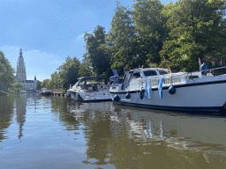 Boats on the Nieuwe Mark river, the Spanjaardsgat gate, the former Post Office and the Grote Kerk church, viewed from our tour boat