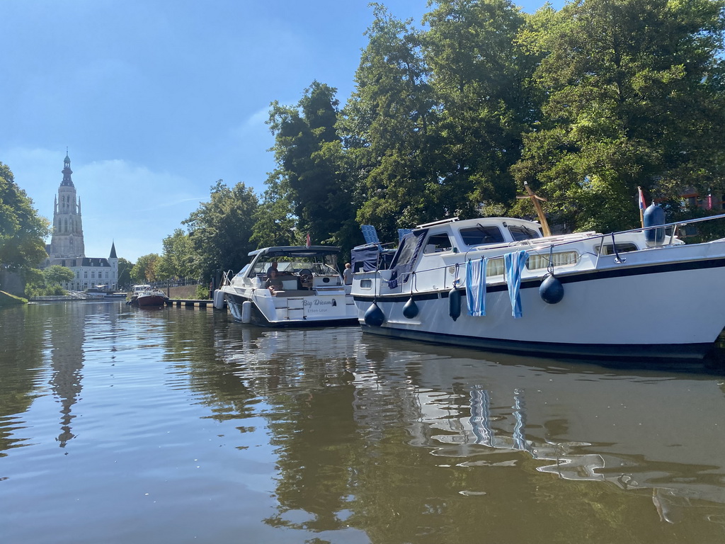 Boats on the Nieuwe Mark river, the Spanjaardsgat gate, the former Post Office and the Grote Kerk church, viewed from our tour boat