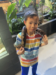 Max`s friend with a Ball Python at the lower floor of the Reptielenhuis De Aarde zoo