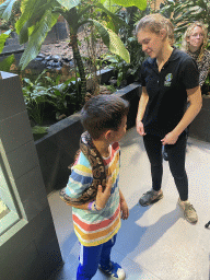 Max`s friend and a zookeeper with a Ball Python at the lower floor of the Reptielenhuis De Aarde zoo