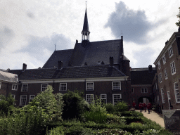 The south side of the Begijnhof garden with the Waalse Kerk church and the Poortgebouw building