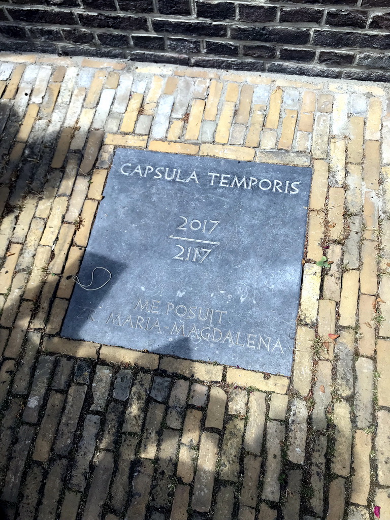 Stone with information on a time capsule at the northeast side of the Begijnhof garden