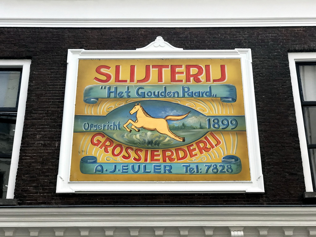 Old sign at the facade of the IJssalon Toetie Froetie shop at the Reigerstraat street