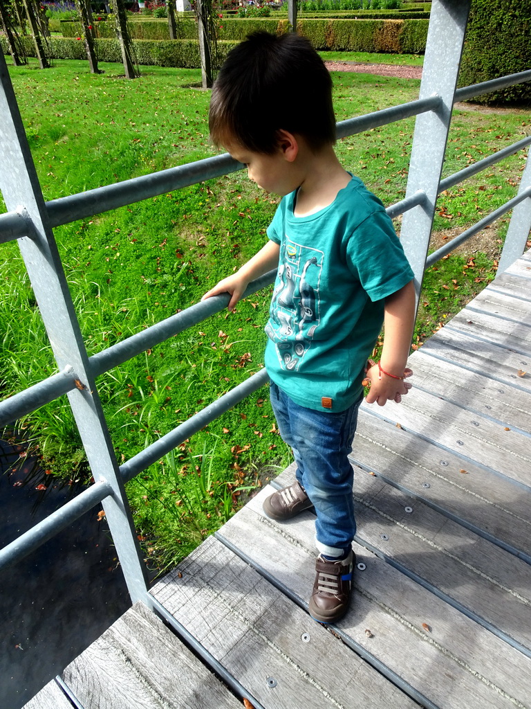 Max on the bridge from the French Garden to the English Garden of Bouvigne Castle