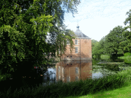 Pond and the southeast side of Bouvigne Castle, viewed from the English Garden