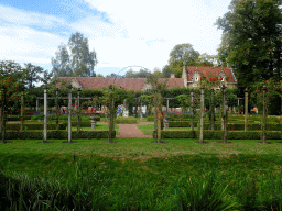 The French Garden and the Koetshuis and Poortgebouw buildings of Bouvigne Castle, viewed from the English Garden