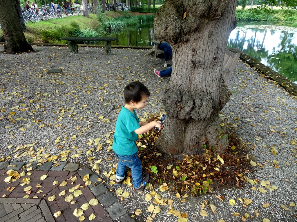 Max with a toy sword near the bridge to Bouvigne Castle