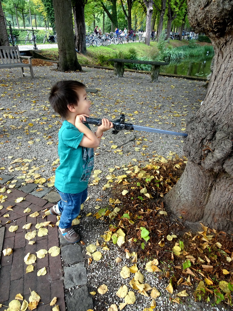 Max with a toy sword near the bridge to Bouvigne Castle