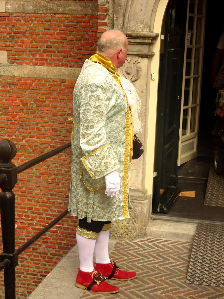 Person dressed in traditional clothing at the bridge to Bouvigne Castle