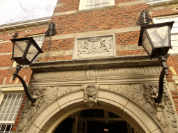 Relief and lamps above the entrance to Bouvigne Castle, viewed from the bridge