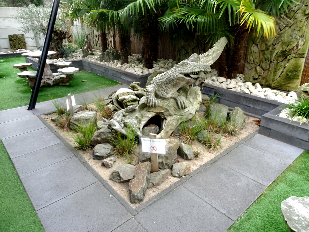 Crocodile statue in the garden of the Reptielenhuis De Aarde zoo