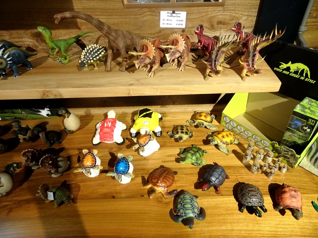 Dinosaur and turle statuettes in the souvenir shop at the lower floor of the Reptielenhuis De Aarde zoo