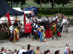 Jester, flag bearers, knights, horses and other actors at the Parade square of Breda Castle, viewed from the staircase to the Blokhuis building, during the Nassaudag