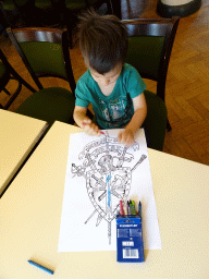 Max with a coloring page at the First Floor of the Main Building of Breda Castle, during the Nassaudag