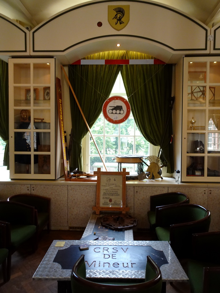 Table, chairs and closet at the Main Hall at the First Floor of the Main Building of Breda Castle, during the Nassaudag