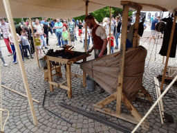 Blacksmith at the Parade square of Breda Castle, during the Nassaudag
