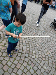 Max with a wooden sword at the Parade square of Breda Castle, during the Nassaudag