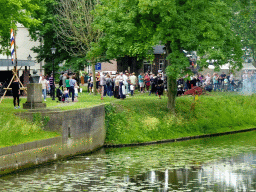 The Mark river and cannons being shot, viewed from the southern bridge of Breda Castle, during the Nassaudag