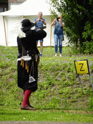 Actor firing a musket at the south side of Breda Castle, viewed from the Cingelstraat street, during the Nassaudag