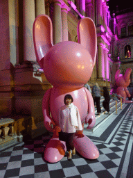 Miaomiao with rabbit statues in front of the Treasury Casino at Queen Street, by night
