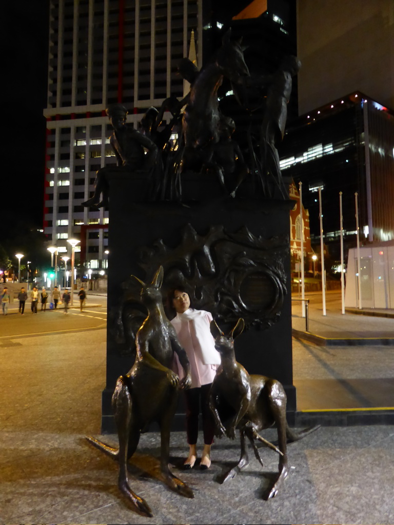 Miaomiao in front of the Petrie Tableau monument at the King George Square, by night