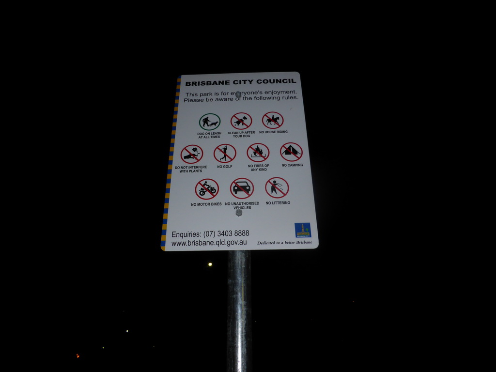 Sign at Wickham Park, by night