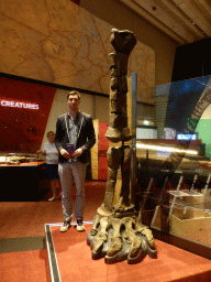 Tim with the bones of a leg of a Rhoetosaurus, at the first floor of the Queensland Museum & Sciencentre