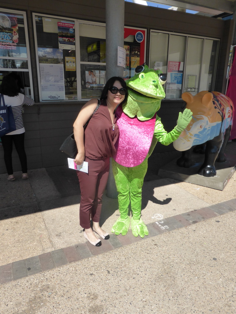 Miaomiao with Wanda, the Eastern Water Dragon, mascot of the Wheel of Brisbane, in front of the cash desk