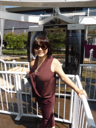 Miaomiao in front of capsule of the Wheel of Brisbane