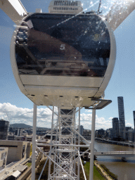 Capsule of the Wheel of Brisbane and the skyline of Brisbane with the Infinity Tower, viewed from the Wheel of Brisbane