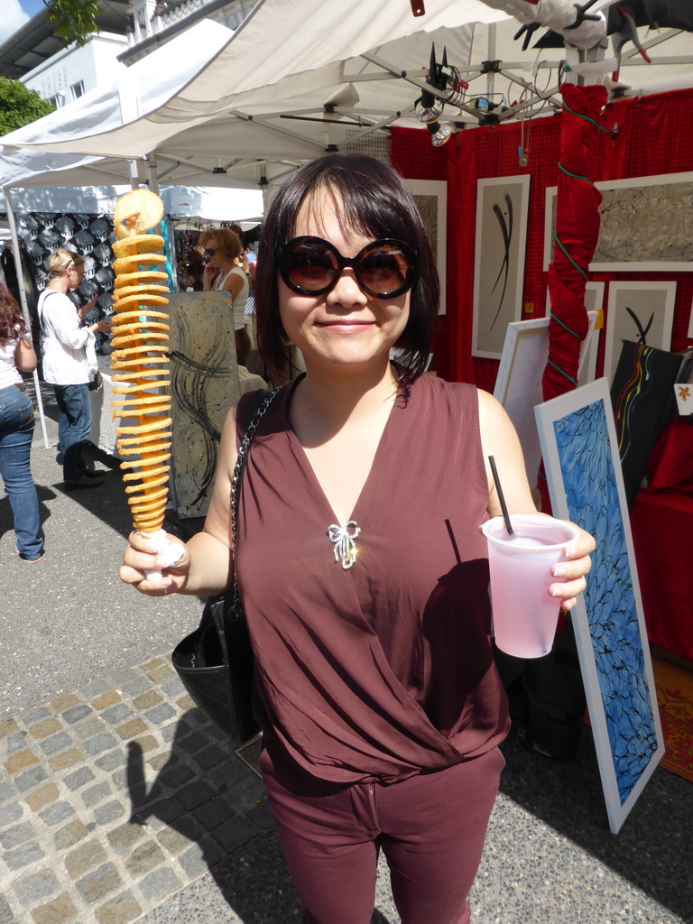 Miaomiao with a twisted potato and a drink at Little Stanley Street