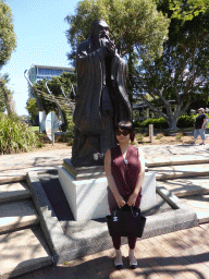 Miaomiao with a statue of Confucius at the square next to the South Bank 3 Ferry Terminal