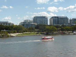 Boat in the Brisbane River, the River Quay Green South Bank and the South Bank 3 Ferry Terminal, viewed from the Goodwill Bridge