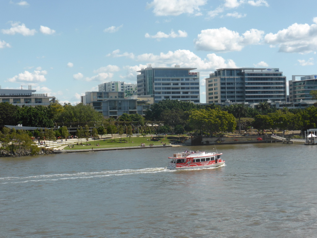 Boat in the Brisbane River, the River Quay Green South Bank and the South Bank 3 Ferry Terminal, viewed from the Goodwill Bridge