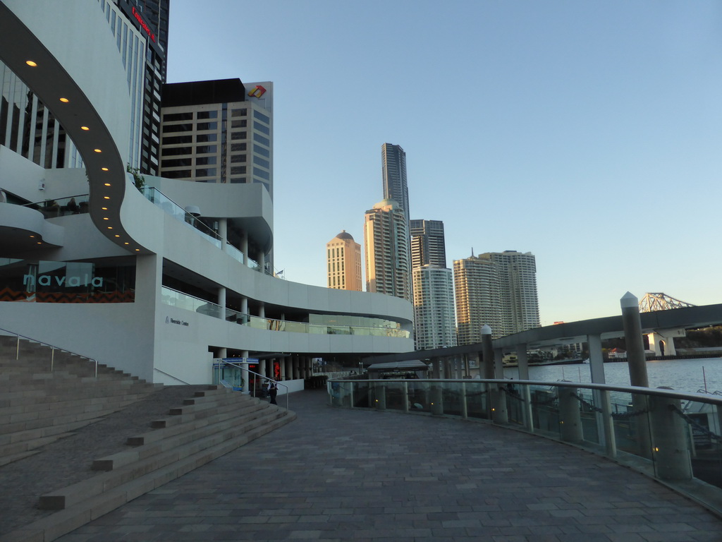 The City Reach Boardwalk, the front of the Riverside Centre building, the skyline of Brisbane with the Soleil Tower and the Story Bridge over the Brisbane River