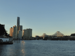 The skyline of Brisbane with the Soleil Tower and the Story Bridge over the Brisbane River, viewed from the City Reach Boardwalk
