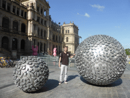 Tim with spheres and rabbit statues in front of the Treasury Casino at Queen Street