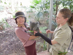 Miaomiao and the zoo keeper with a Koala during the Koala Cuddling at the Lone Pine Koala Sanctuary